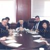 Dr. Lander in a meeting with Touro administrators in 1996.